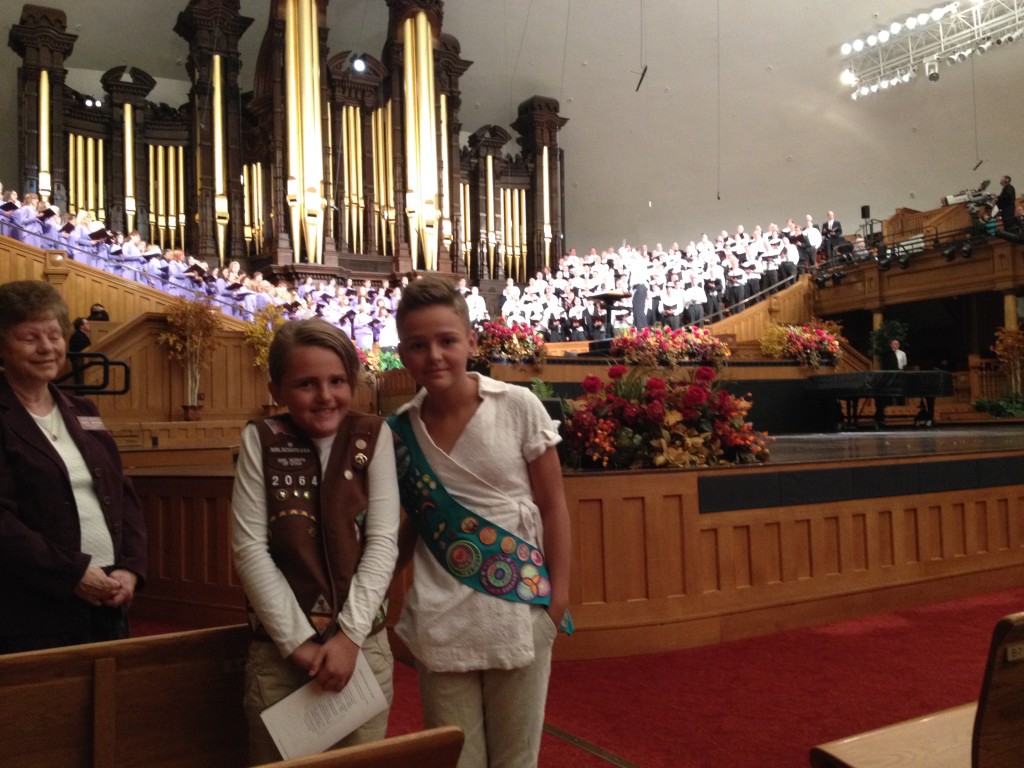 two girl scouts standing in front of the Mormon Tabernacle Choir